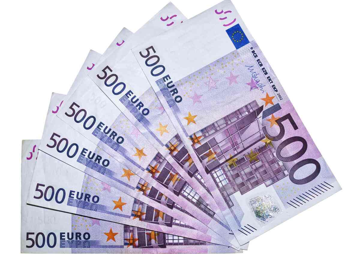 Euro banknotes fanned out on white background