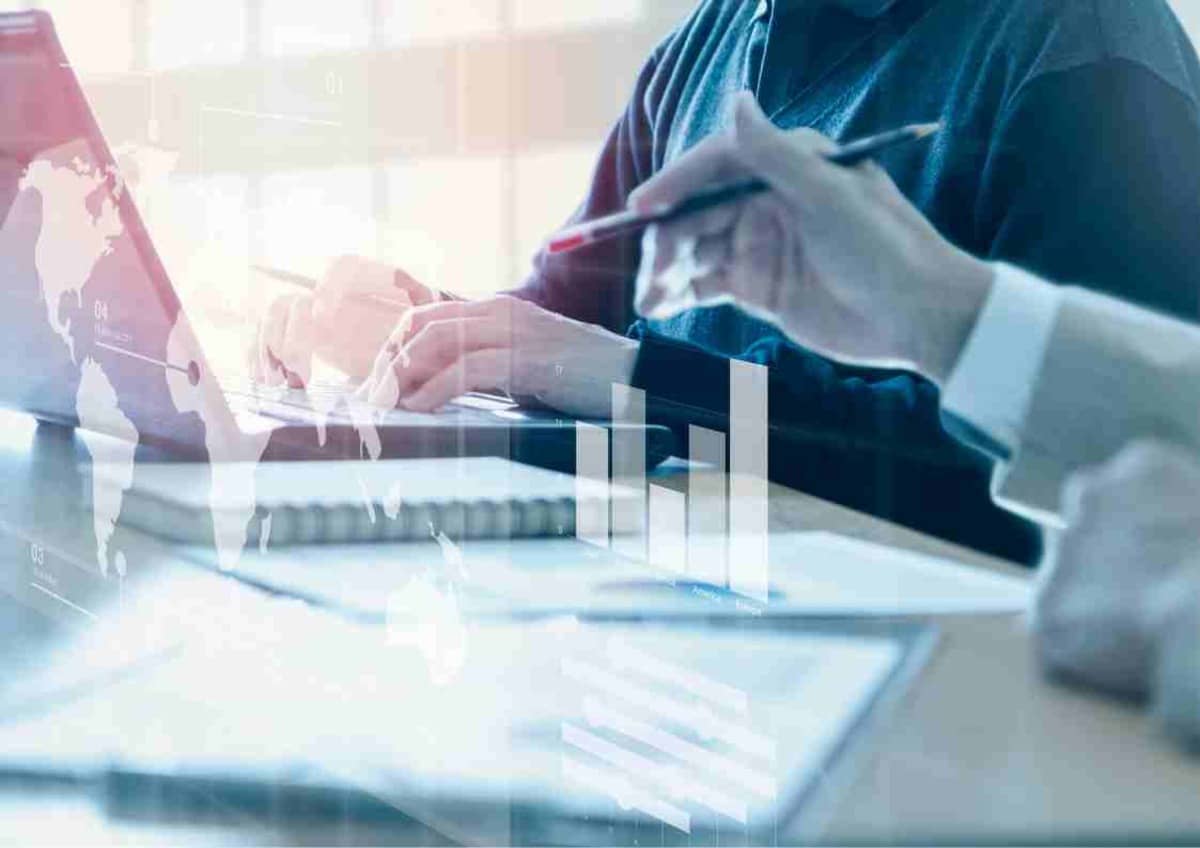 Person analysing a financial report on a clipboard; hints at data analysis