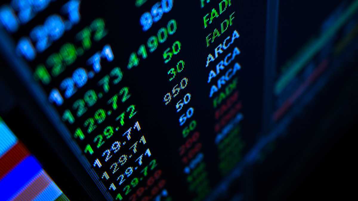 Close-up of a financial data screen with stock numbers and trends