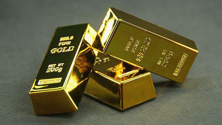 A trio of pure gold bars clustered