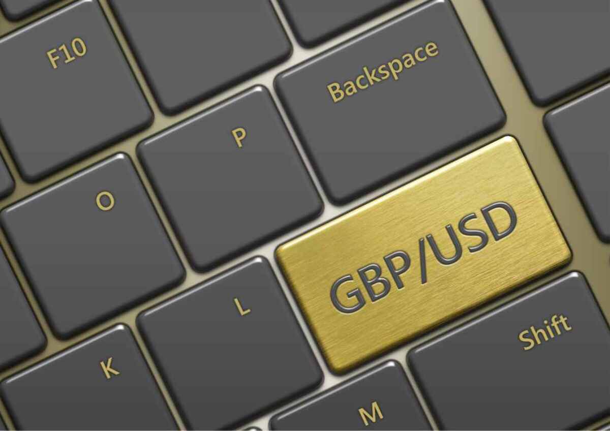 Computer keyboard with a golden 'GBP/USD' key.