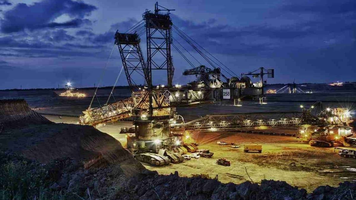 Large machinery operating within an open-pit mining site