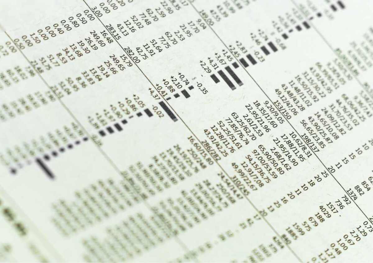 Close-up of financial figures in a newspaper.