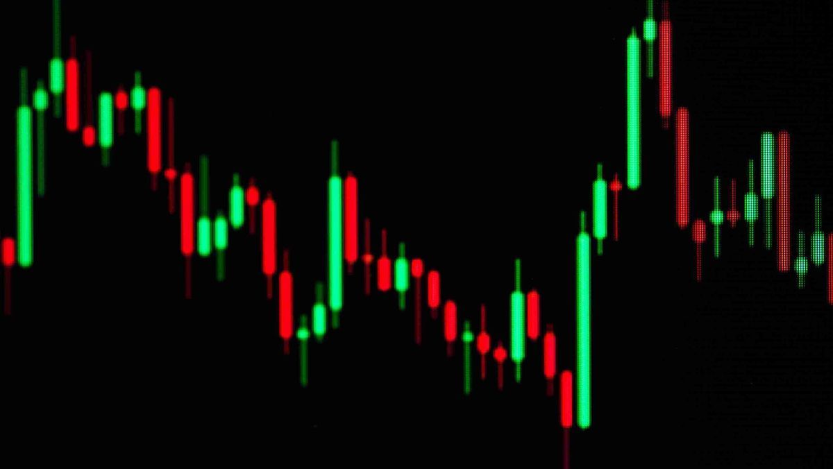 Red and green candlestick patterns with a dark background