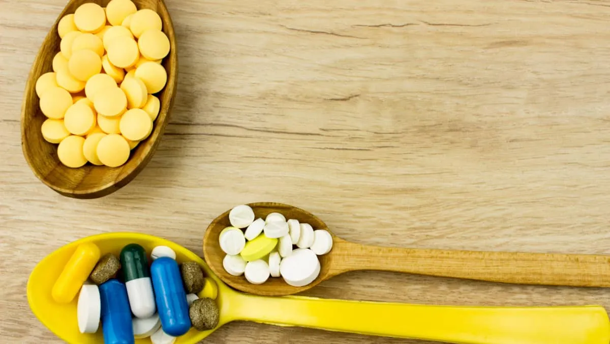 Capsules and tablets on a spoon Medicine pharmaceutical theme