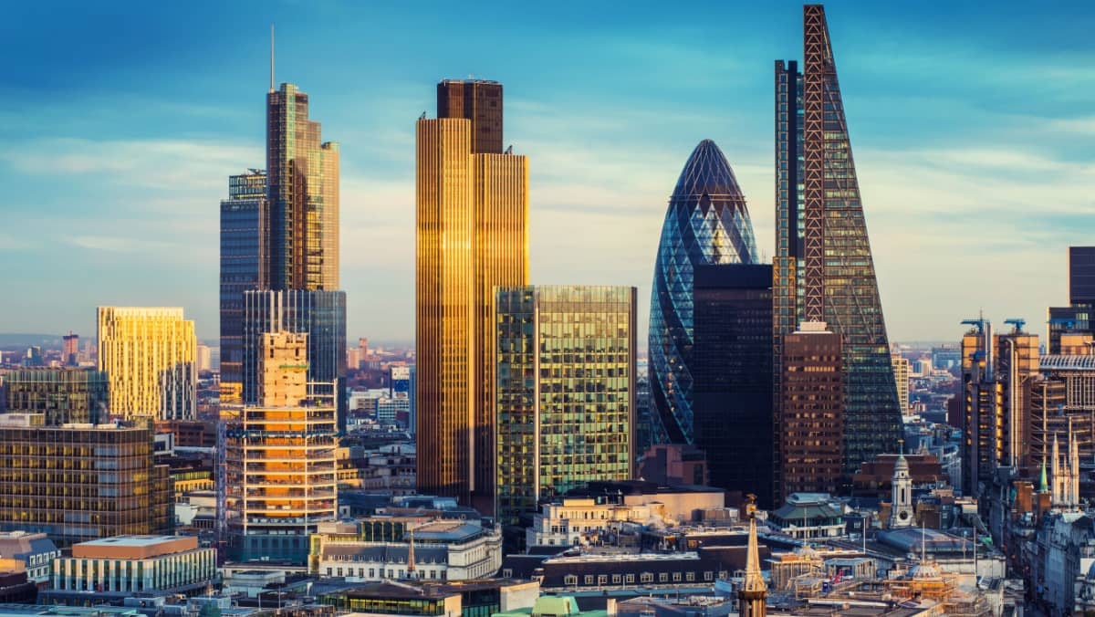 The bank district of central London with famous skyscrapers and other landmarks at sunset with blue sky 