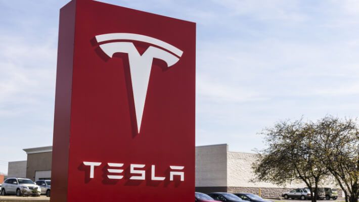 Tesla tops Wall Street