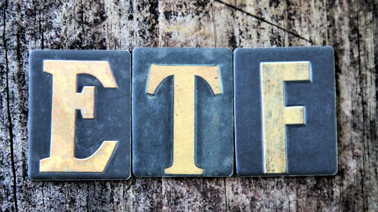 Tiles with ETF on a wooden background