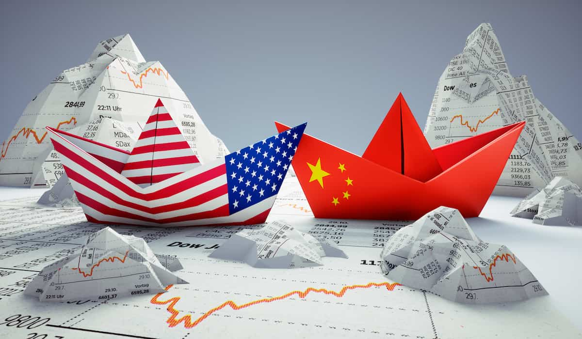 Stock market charts show volatility due to customs tax for trade from China to USA.