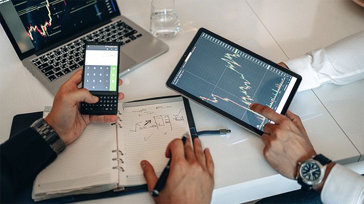 two men studying intraday trading