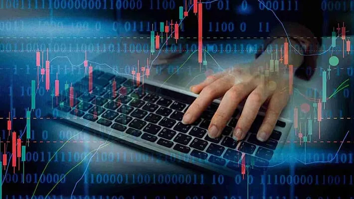 a hand poised over a computer keyboard set against a backdrop of financial charts and data analysis