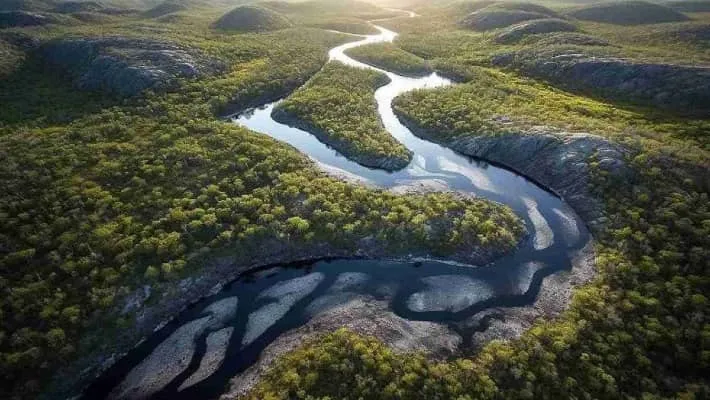 A flowing river in a pastoral landscape