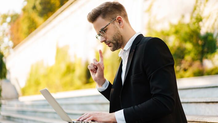 trader choosing the best ETFs on his laptop