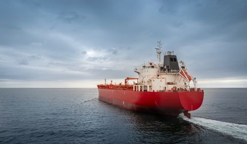 A tanker carrying heating oil on a foggy morning, symbolizes the global energy trade.